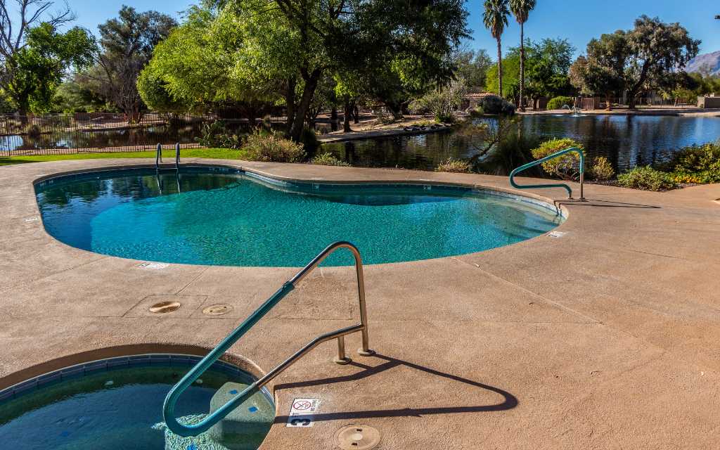 One of the 2 neighborhood pools which also has a spa and is located next to one of the lakes
