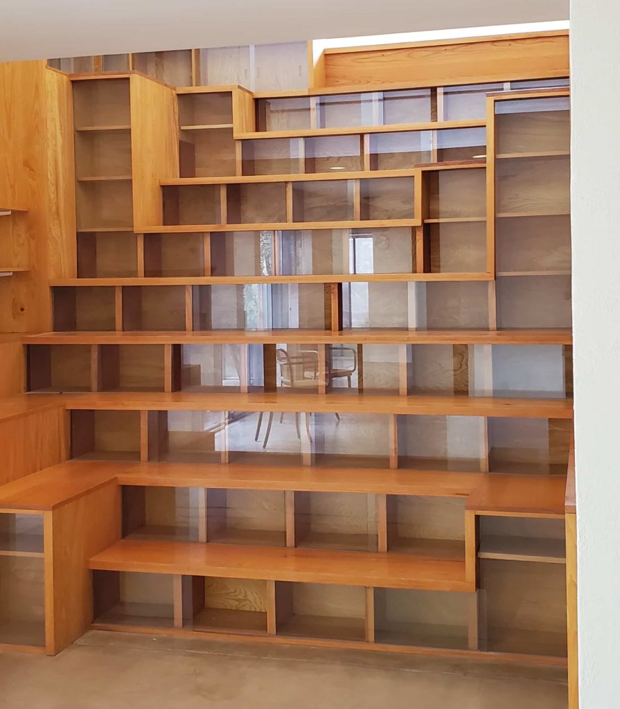 This unique bookcase is a focal point near the home's entry. The bookcase forms stairs that lead to a reading nook that has wonderful mountain views and plenty of natural light.