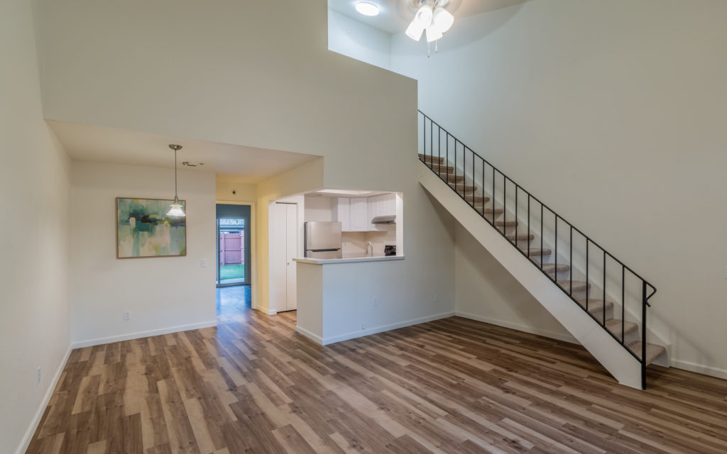interior of a remodeled townhome with new flooring and new kitchen