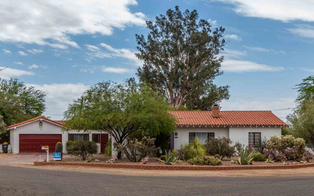 This ranch style home with a clay tile roof in San Clemente has a lot of curb appeal