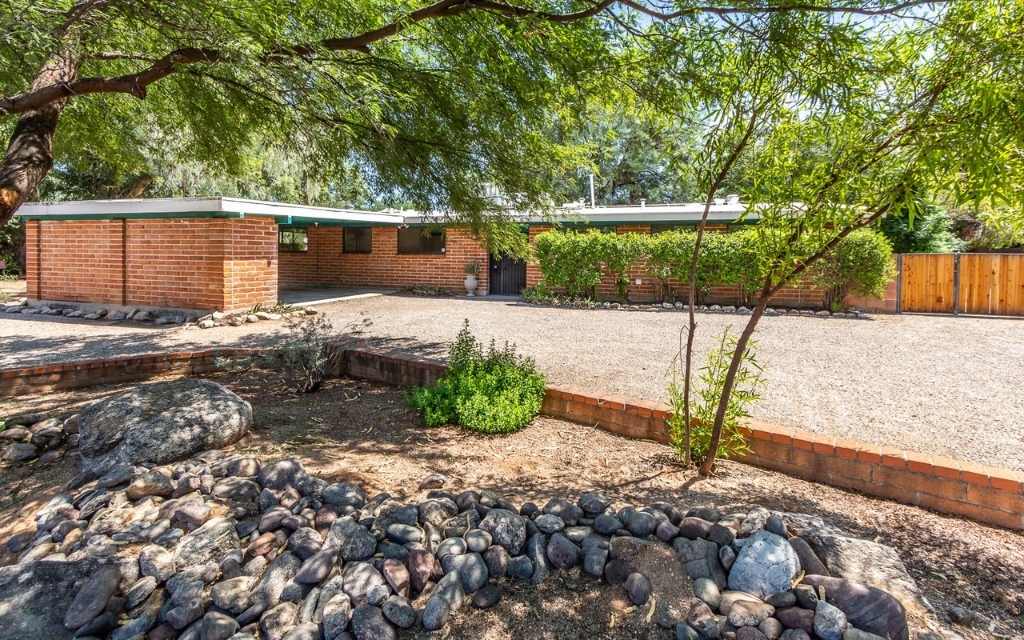 Burnt adobe home in Indian Ridge, exterior view. 3050 N Tecumseh Ct, Tucson AZ 85715