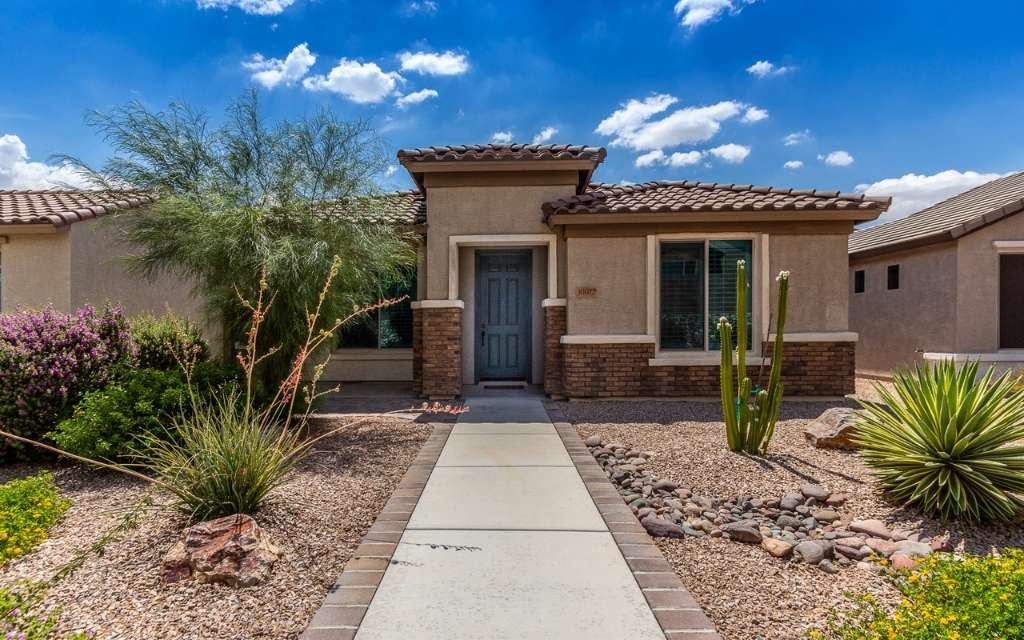 exterior of a home in a 55+ master planned community in Tucson Arizona. 55+ communities are another option for helping aging parents.