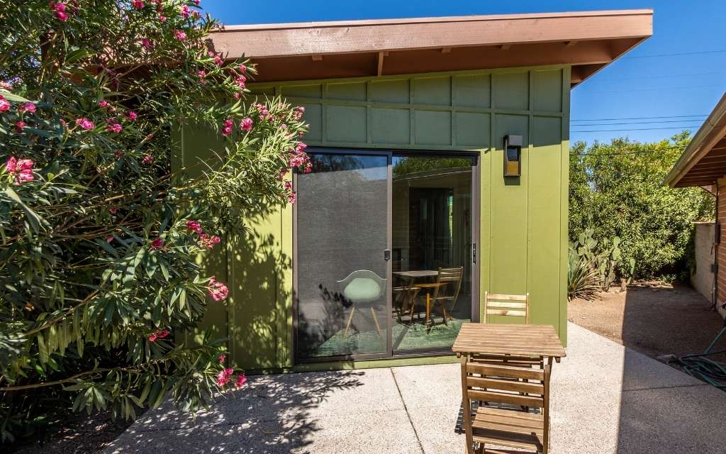 Example of a recently built ADU guest house built adjacent to the main home shown on the right.