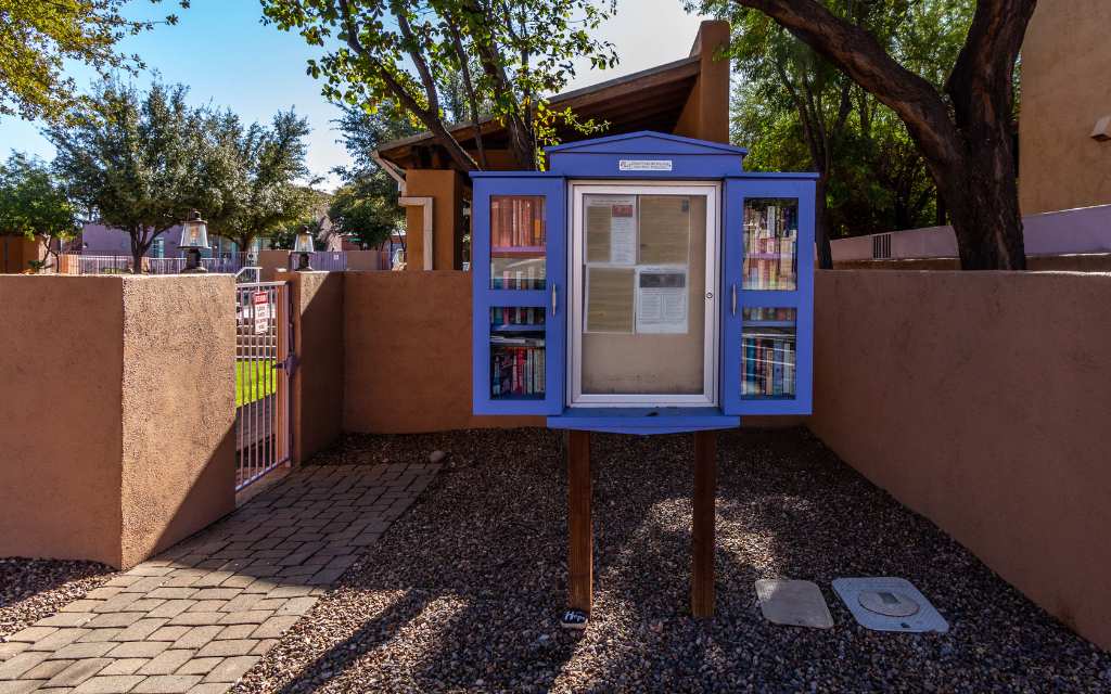 Little free library and community info board at Presidio at Williams Center