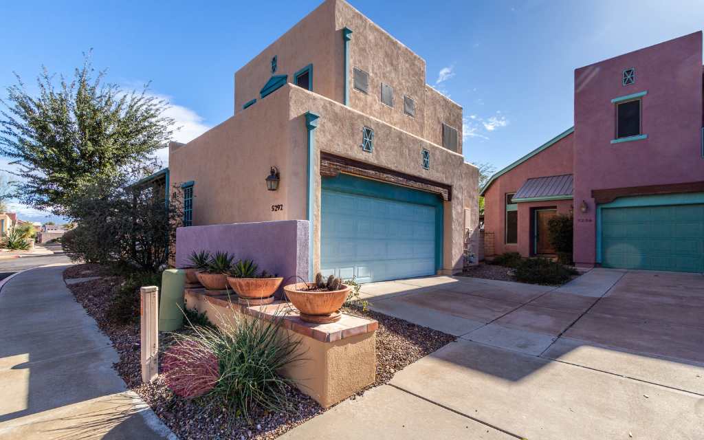5292 E Calle Vista de Colores, Tucson AZ 85711. Home for sale. 2-story southwestern style colorful house with a garage.