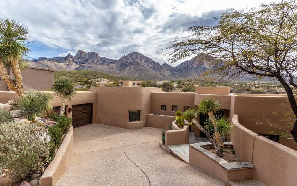 Custom homes are among the housing options within La Reserve neighborhood. The back of this home features unparalleled views of Pusch Ridge.