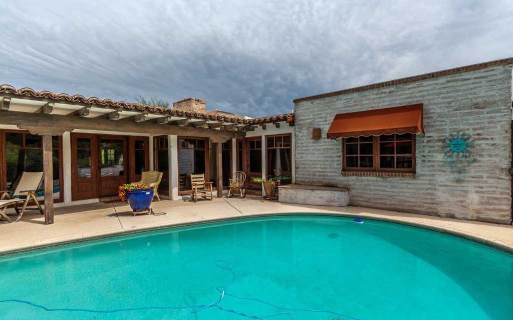 Catalina Foothills burnt adobe home with a pool sold by Nick Labriola, Tierra Antigua Realty