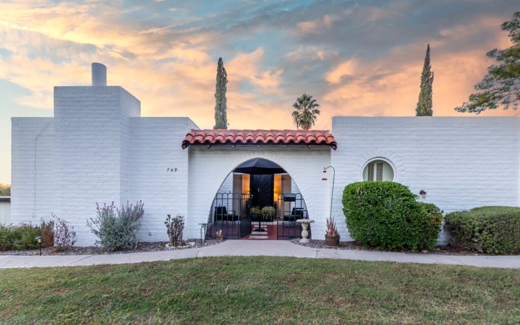 White painted masonry condo designed by architect Bennie Gonzalez in the 55+ neighborhood of Las Lomitas, also known as Casitas de Castilian.