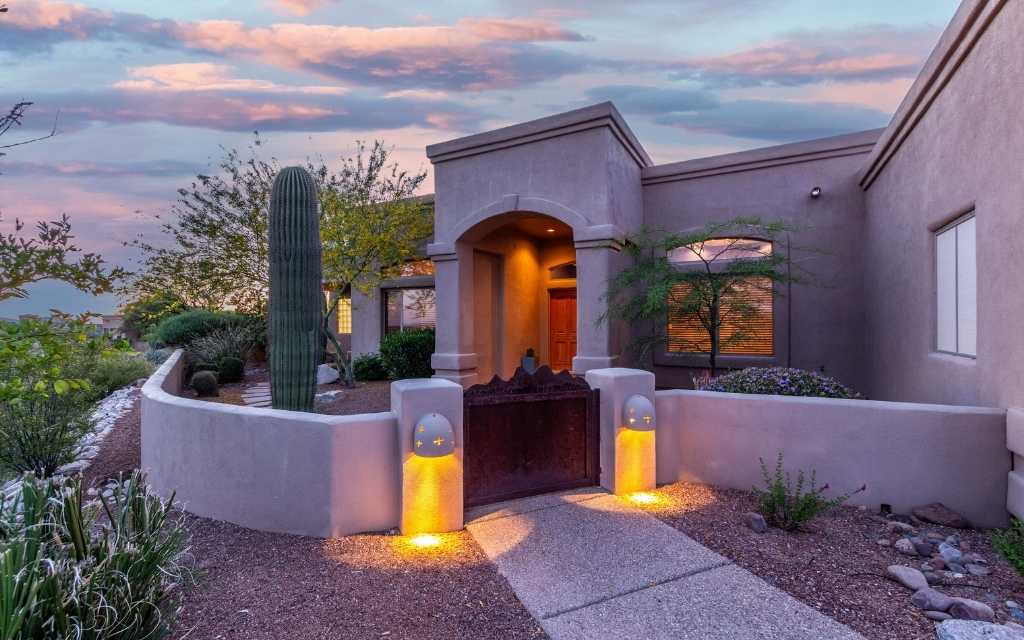 Custom home built on the east side of town with a charming front courtyard.