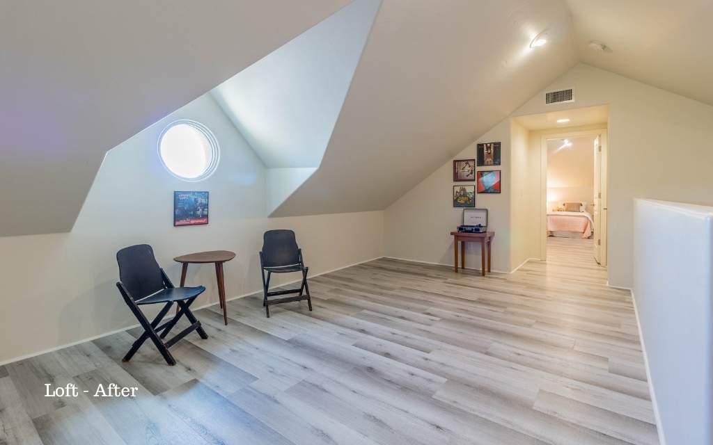 A loft that has been staged as a spot to listen to vinyl records.