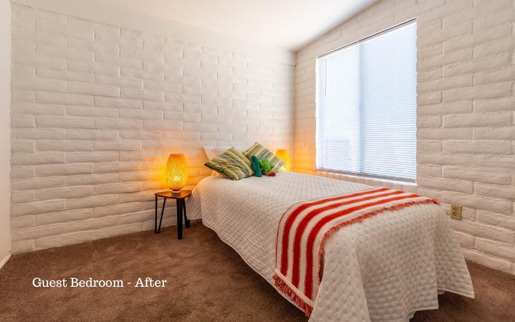 We staged this small bedroom as a child's room with a twin bed to show off how much floor space was available in this compact home.