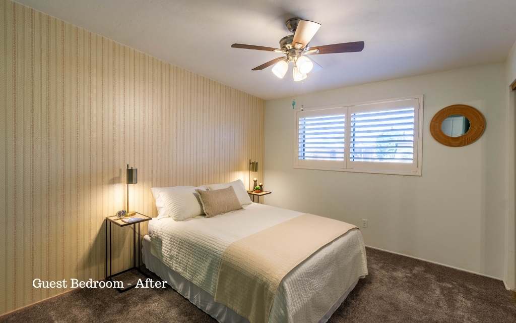 This guest bedroom looks inviting after staging it with neutral bedding and furniture.