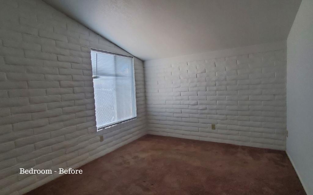 Bedroom shown before light staging.