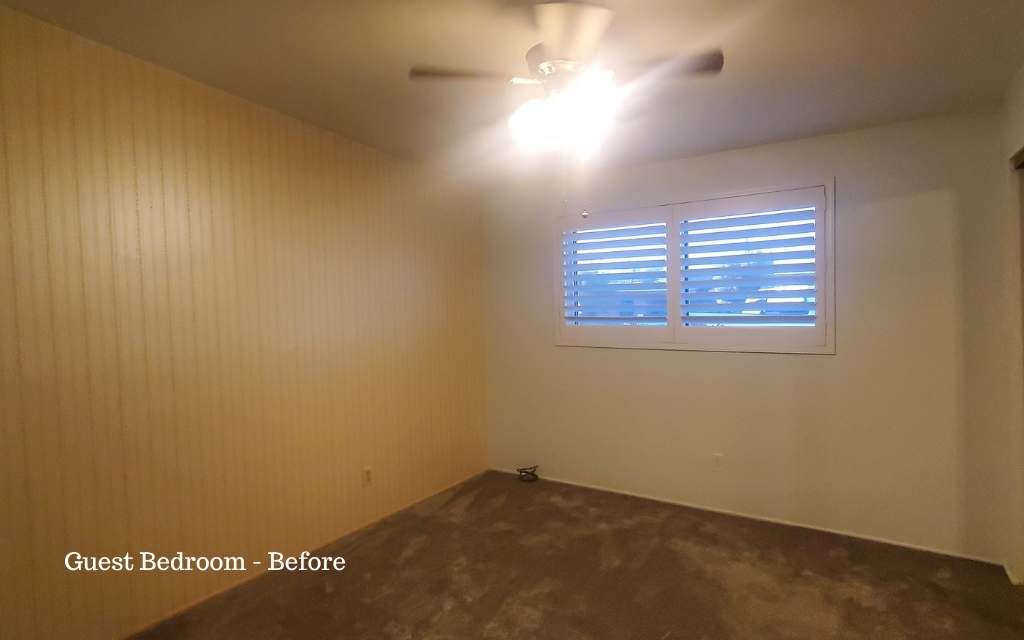 Before staging, this guest bedroom looked dated with the wallpaper. But staging neutralized the wallpaper and pulled the room together.